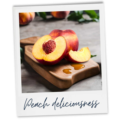 Juicy peach and slices on wooden board