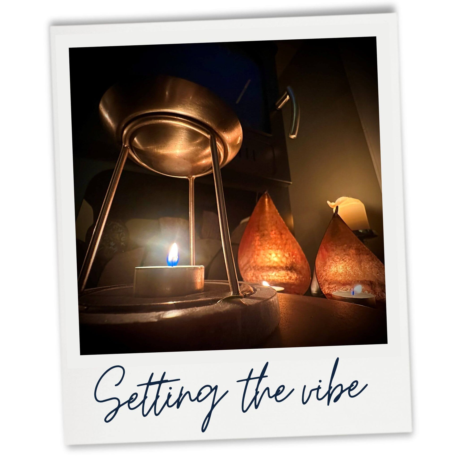 Setting the vibe with candle lit fire place and wax melt warmer